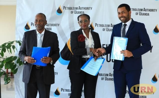 Oil and gas regulators from Tanzania Uganda and Zaibar exchange papers after signing Cooperation MOU